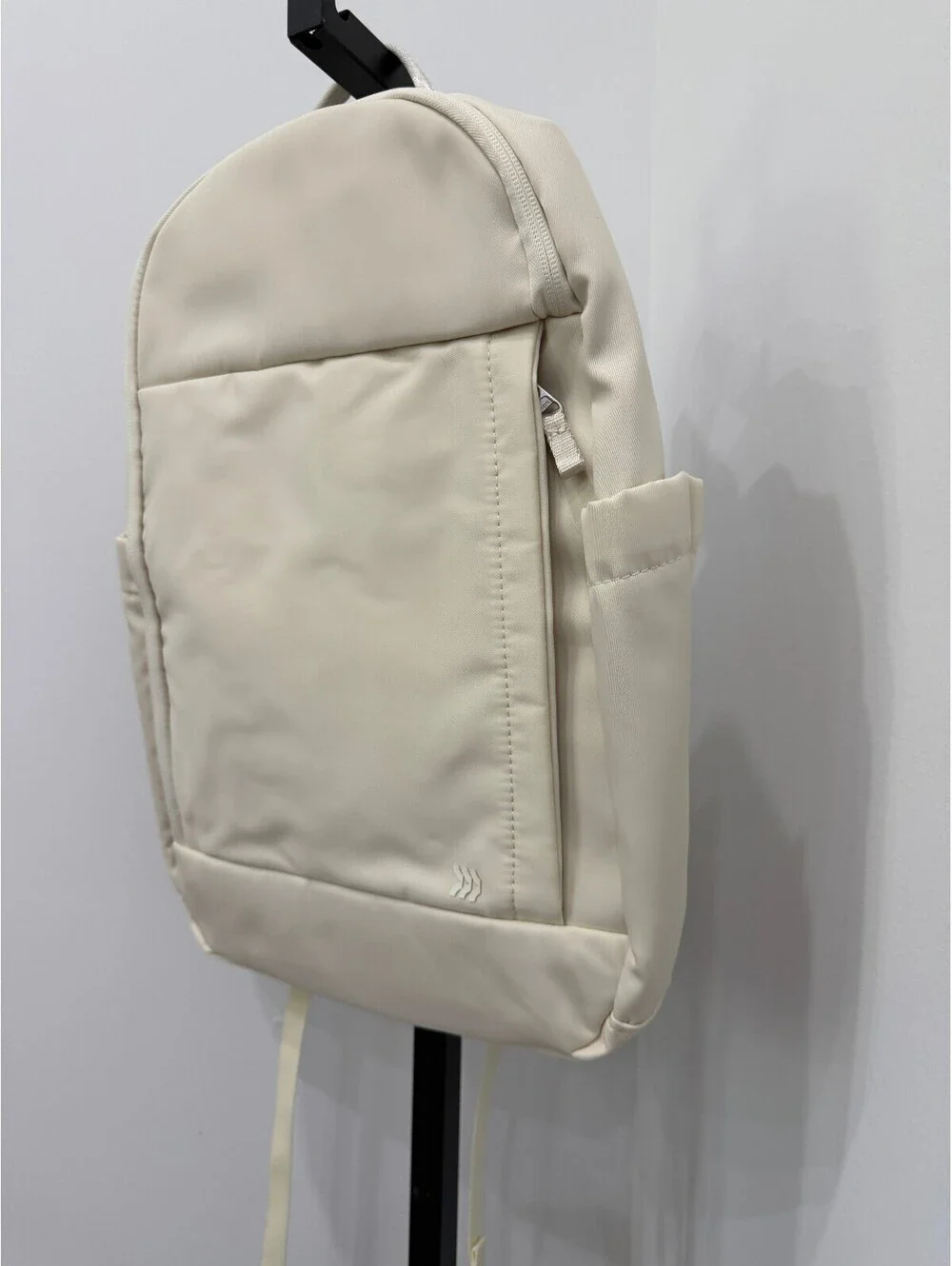 All in Motion Minimalist Cream Backpack with Side Pockets and Padded Straps